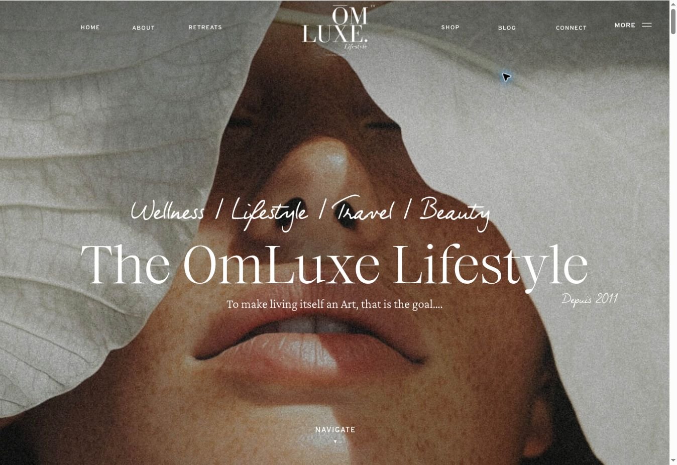 OmLuxe homepage: immersive lifestyle imagery with serif and handwritten typography.